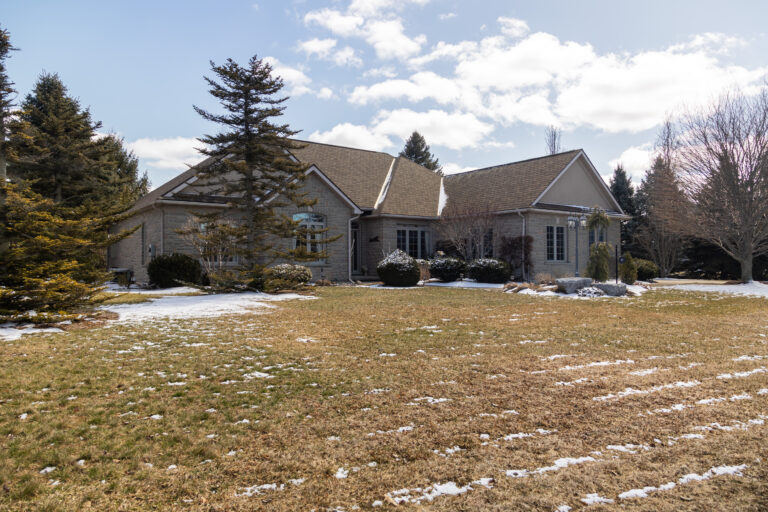 Absolutely gorgeous stone & stucco custom-built ranch backing onto the sixth hole of Otter Creek Golf Club.