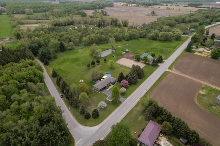 Absolutely immaculate and completely turnkey hobby farm on 8 acres of land on a beautiful winding country road.