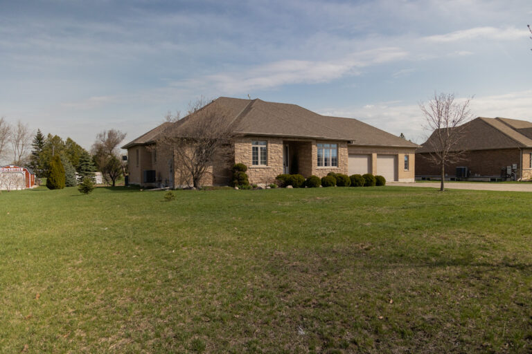 Welcome to 168 Hwy 53, Cathcart– a lovely custom home perched on a sprawling ¾ acre lot in the countryside.