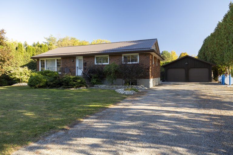 Absolutely stunning, all brick bungalow with a fully finished basement apartment and the amazing 23’ x 30’ detached & heated workshop, on a half acre country lot.
