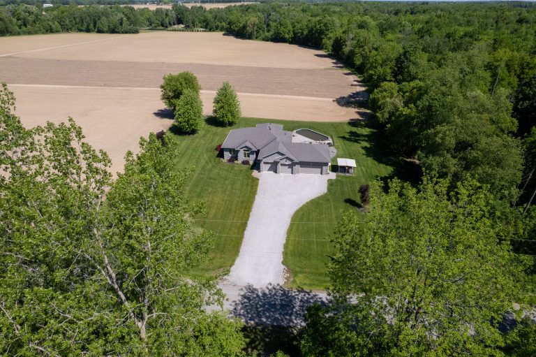 Fantastic custom built all brick home with a four-car attached garage on a 0.92 acre country lot!