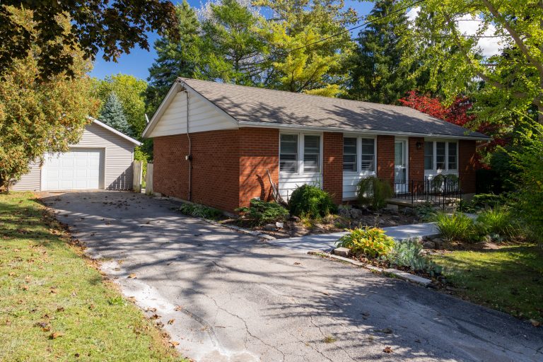 Immaculate 3-bedroom brick bungalow with in-law suite potential on almost a half acre lot and with possible severance potential.
