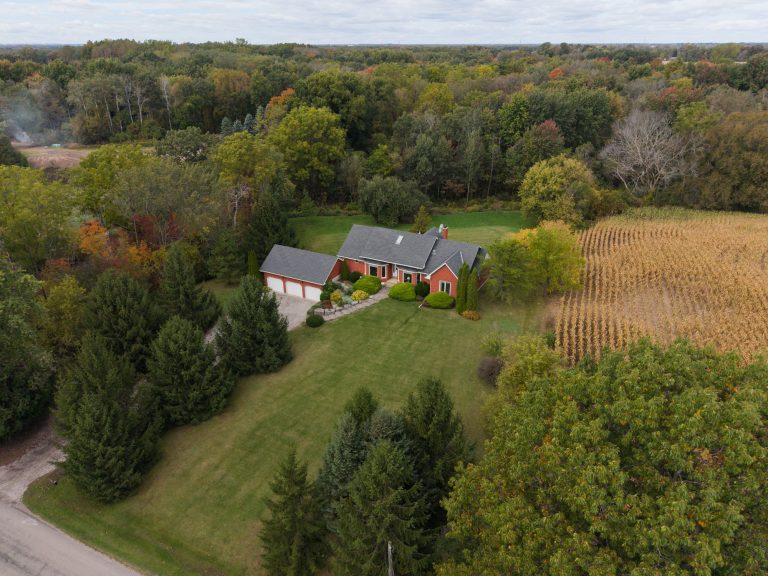 Fantastic custom built family home with triple car attached garage on a 31.2 acre (mostly) wooded lot.